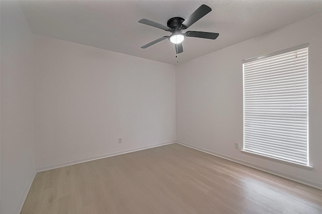 6219 Canada Dr, Pasadena, TX 77505 - spare room featuring baseboards, light wood-style floors, and a ceiling fan