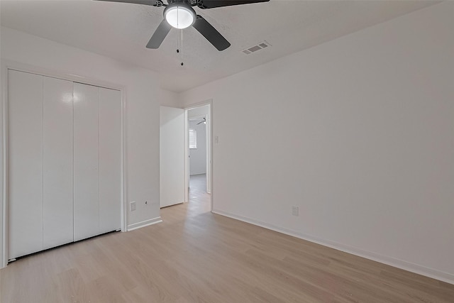 6219 Canada Dr, Pasadena, TX 77505 - unfurnished bedroom with a closet, baseboards, visible vents, light wood-style floors, and ceiling fan