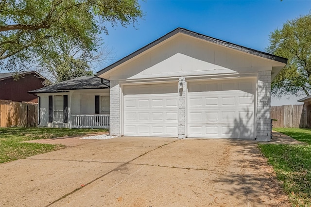 6219 Canada Dr, Pasadena, TX 77505 - view of front of property featuring a porch, fence, brick siding, and a garage