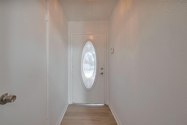 6219 Canada Dr, Pasadena, TX 77505 - doorway featuring baseboards and light wood-style floors