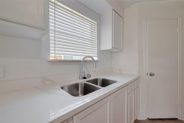 6219 Canada Dr, Pasadena, TX 77505 - kitchen featuring white cabinets and a sink