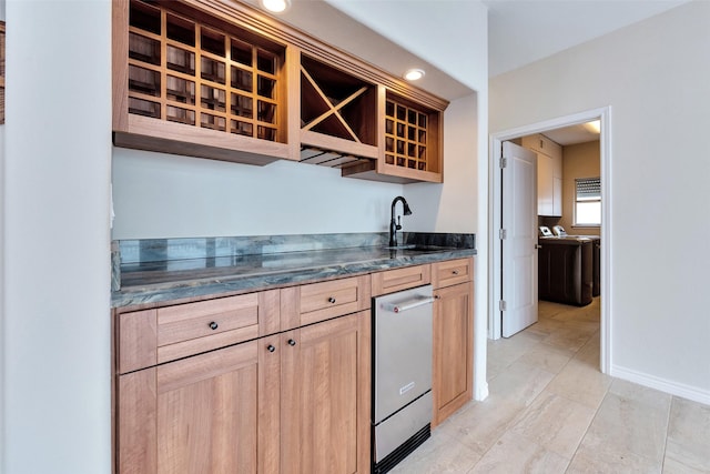 bar featuring wet bar, dishwasher, and a sink