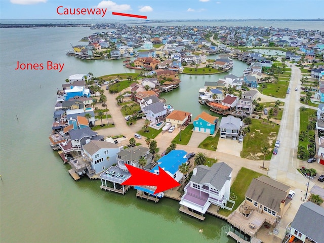 drone / aerial view with a residential view and a water view