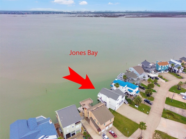bird's eye view featuring a water view and a residential view