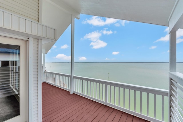 wooden deck featuring a water view
