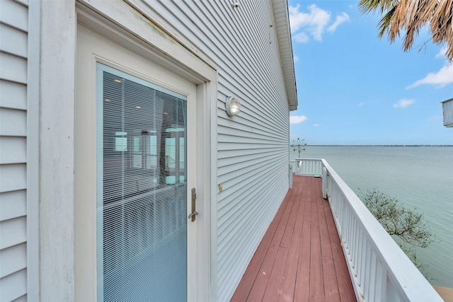 wooden deck featuring a water view