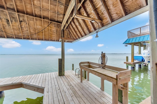 view of dock with a water view and boat lift