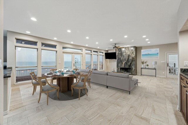 301 Isles End Rd, Tiki Island, TX 77554 - dining room with a premium fireplace, recessed lighting, and a ceiling fan