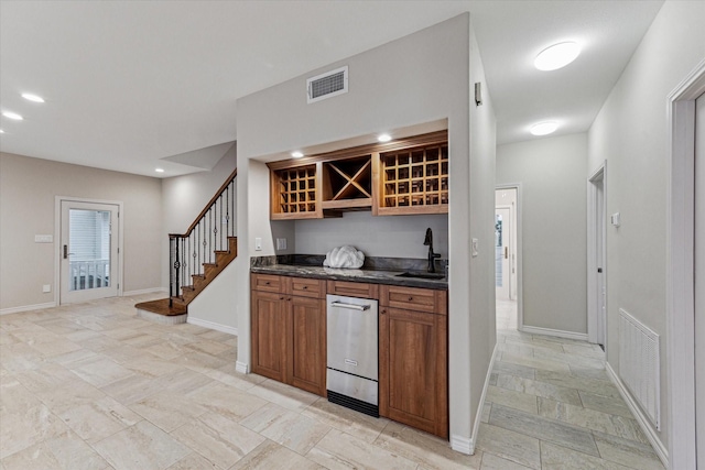 301 Isles End Rd, Tiki Island, TX 77554 - indoor wet bar with stairway, baseboards, dishwasher, light stone finish flooring, and recessed lighting