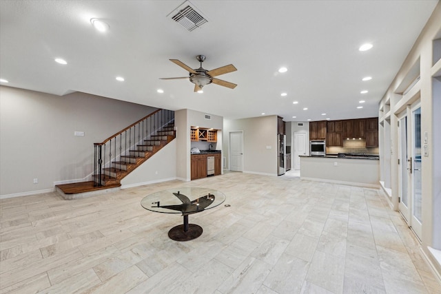 301 Isles End Rd, Tiki Island, TX 77554 - unfurnished living room with recessed lighting, stairs, a ceiling fan, and baseboards