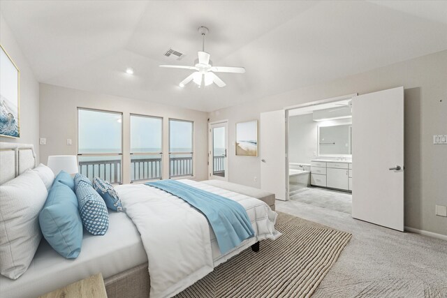 301 Isles End Rd, Tiki Island, TX 77554 - bedroom with light carpet, a water view, connected bathroom, baseboards, and ceiling fan