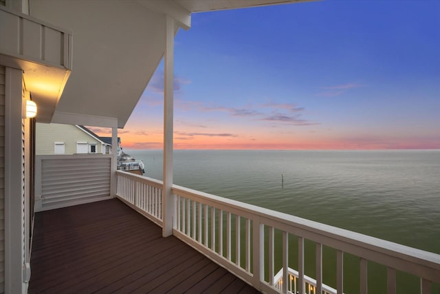 301 Isles End Rd, Tiki Island, TX 77554 - deck at dusk featuring a water view