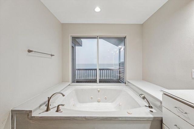 301 Isles End Rd, Tiki Island, TX 77554 - bathroom with vanity and a tub with jets