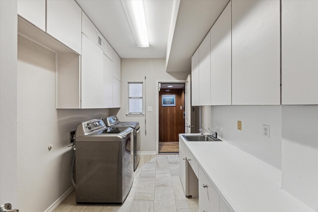 301 Isles End Rd, Tiki Island, TX 77554 - laundry room featuring cabinet space, washer and clothes dryer, and baseboards