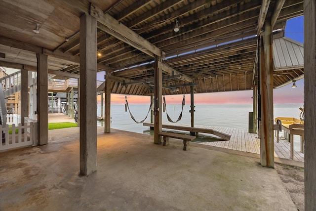 301 Isles End Rd, Tiki Island, TX 77554 - view of patio / terrace with boat lift, a water view, and a boat dock