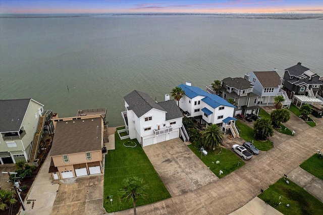 301 Isles End Rd, Tiki Island, TX 77554 - aerial view at dusk of a water view and a residential view