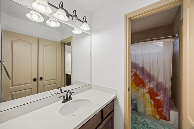 bathroom with a shower and vanity