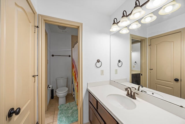 bathroom featuring vanity, tile patterned flooring, visible vents, and toilet