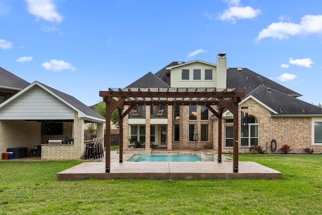 back of property with a patio, a pergola, and brick siding
