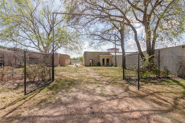 724 S Main St, Calvert, TX 77837 - view of yard with a gate, fence, and french doors