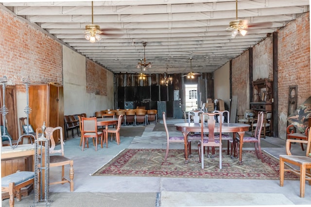 724 S Main St, Calvert, TX 77837 - dining room featuring a high ceiling, concrete floors, and brick wall