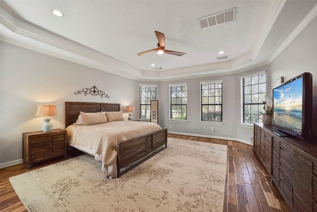 27603 Siandra Creek Ln, Spring, TX 77386 - bedroom featuring a raised ceiling, crown molding, dark wood-type flooring, baseboards, and recessed lighting