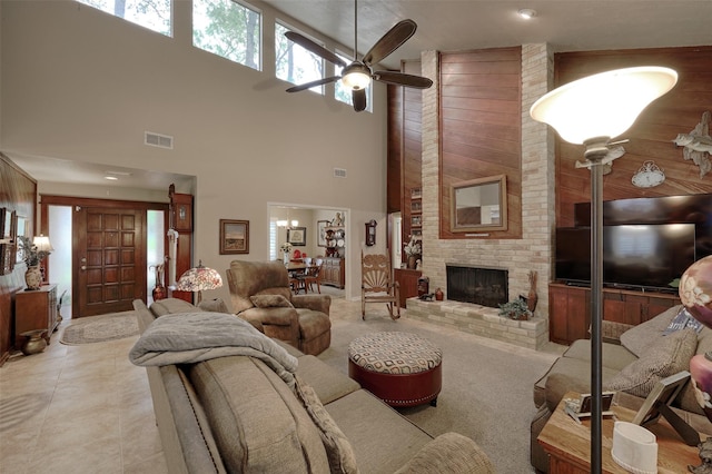 900 Manchester Dr, Conroe, TX 77304 - living room with a towering ceiling, a ceiling fan, and a brick fireplace