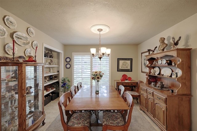 900 Manchester Dr, Conroe, TX 77304 - dining space featuring a chandelier and a textured ceiling