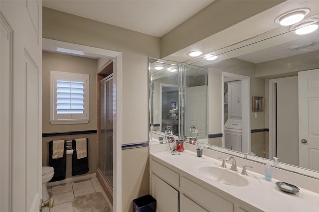900 Manchester Dr, Conroe, TX 77304 - bathroom with toilet, a shower stall, vanity, and tile patterned flooring