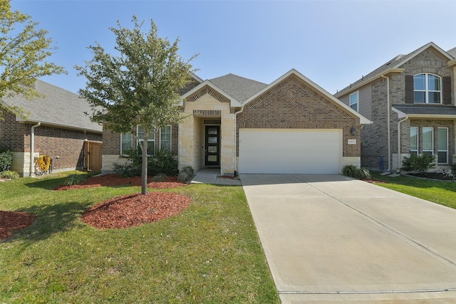 view of front of property featuring a front yard, brick siding, concrete driveway, and an attached garage