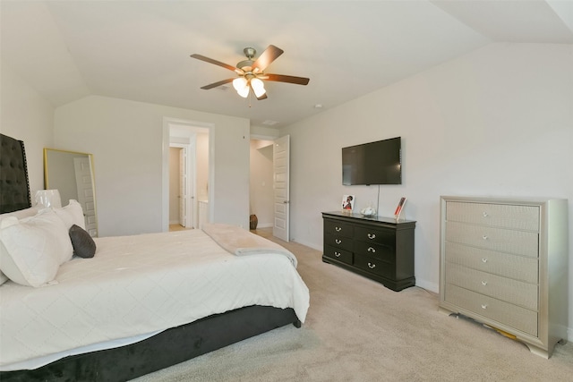 bedroom featuring light carpet, lofted ceiling, and ceiling fan