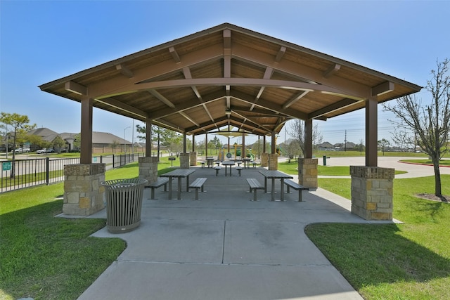 surrounding community with fence, a gazebo, a yard, and a patio