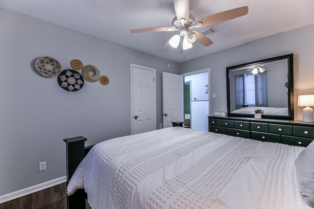 bedroom with a ceiling fan, dark wood-style flooring, baseboards, and visible vents