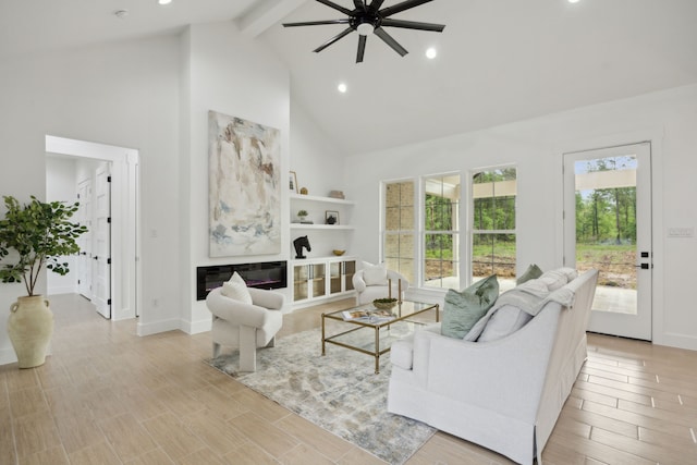 1252 Rd 6604, Dayton, TX 77535 - living area with high vaulted ceiling, ceiling fan, beamed ceiling, healthy amount of natural light, and baseboards