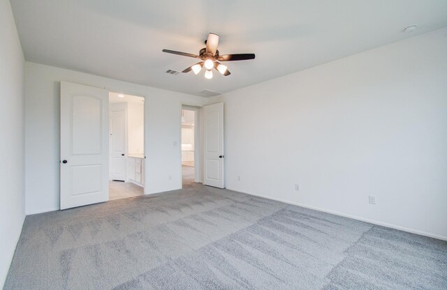 693 Cape Capri Dr, Katy, TX 77493 - empty room with light carpet, visible vents, and a ceiling fan
