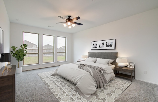 693 Cape Capri Dr, Katy, TX 77493 - bedroom featuring light colored carpet, visible vents, baseboards, and a ceiling fan