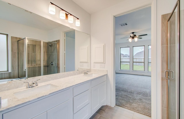 693 Cape Capri Dr, Katy, TX 77493 - full bathroom featuring a shower stall, visible vents, a sink, and a ceiling fan