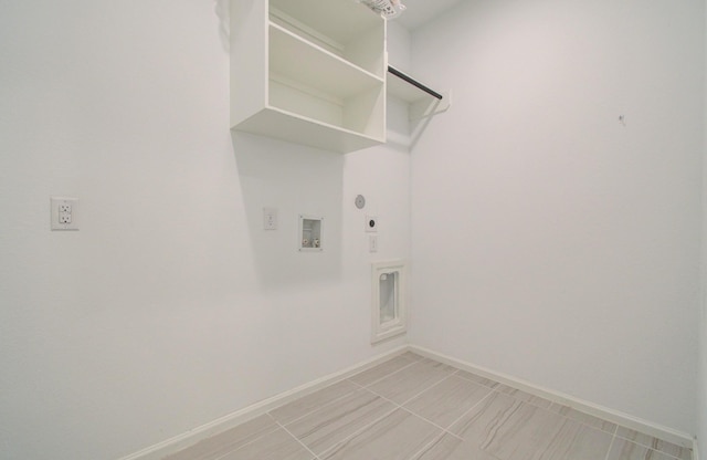 693 Cape Capri Dr, Katy, TX 77493 - washroom with hookup for a gas dryer, washer hookup, baseboards, laundry area, and electric dryer hookup