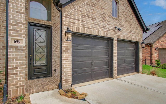 693 Cape Capri Dr, Katy, TX 77493 - property entrance featuring brick siding and concrete driveway