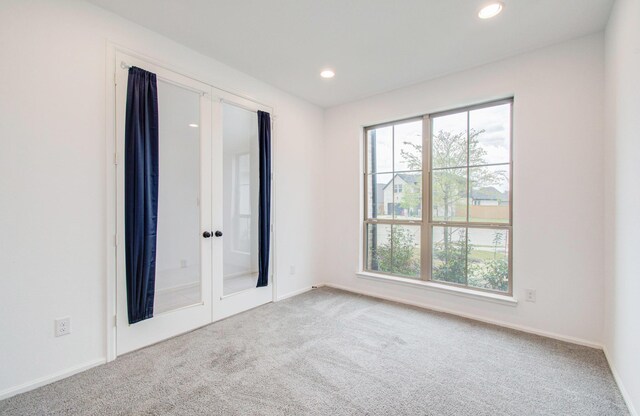 693 Cape Capri Dr, Katy, TX 77493 - spare room with baseboards, recessed lighting, carpet flooring, and a healthy amount of sunlight