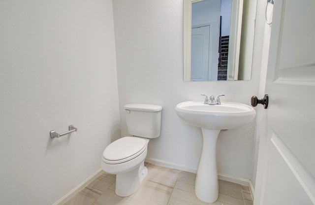 693 Cape Capri Dr, Katy, TX 77493 - bathroom featuring toilet and baseboards