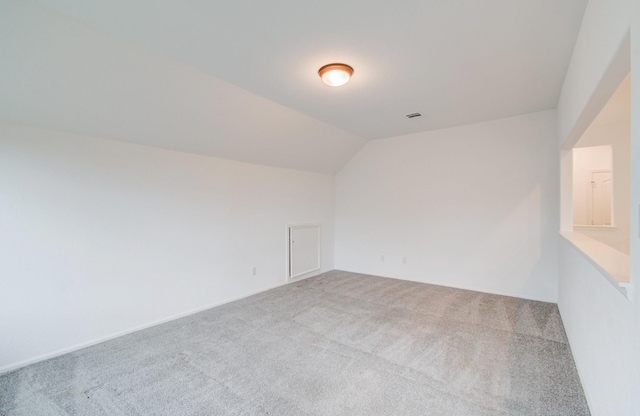 693 Cape Capri Dr, Katy, TX 77493 - empty room with carpet flooring, visible vents, and vaulted ceiling