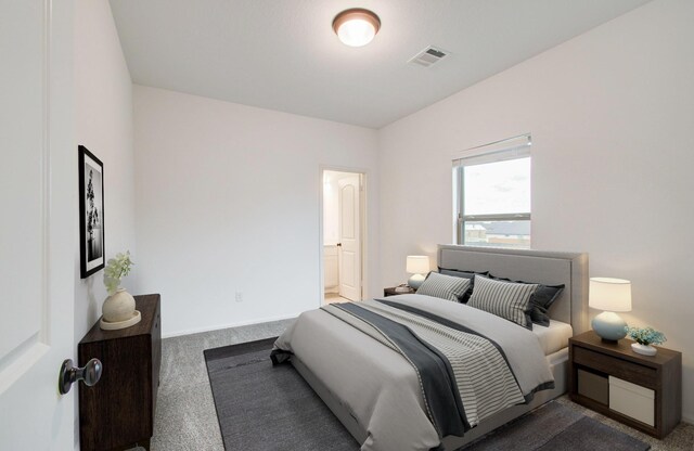 693 Cape Capri Dr, Katy, TX 77493 - bedroom with carpet flooring, connected bathroom, and visible vents