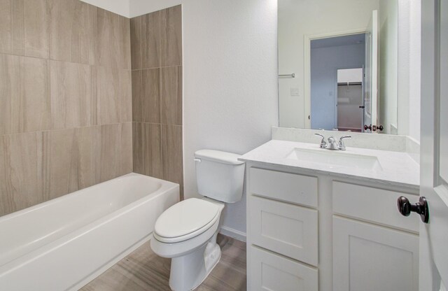 693 Cape Capri Dr, Katy, TX 77493 - full bathroom with toilet, vanity, and wood finished floors