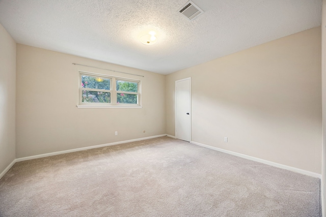 11814 Drexelbrook Dr, Houston, TX 77077 - empty room featuring light colored carpet and a textured ceiling