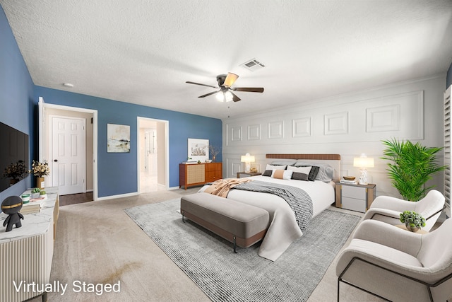 11814 Drexelbrook Dr, Houston, TX 77077 - bedroom with carpet flooring, a textured ceiling, a ceiling fan, and connected bathroom