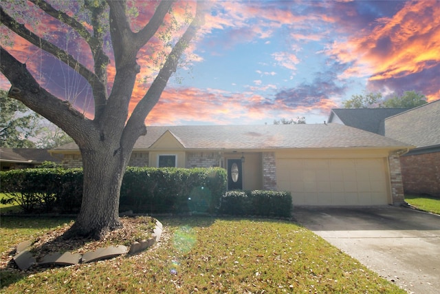 ranch-style home featuring brick siding, driveway, a front lawn, and an attached garage