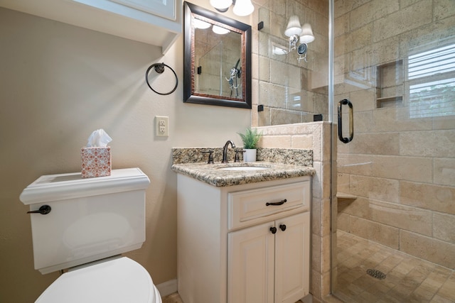 full bath with toilet, a shower stall, and vanity