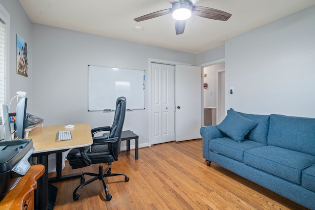 office space with ceiling fan, visible vents, and light wood-type flooring