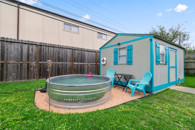 exterior space featuring an outdoor structure and a fenced backyard